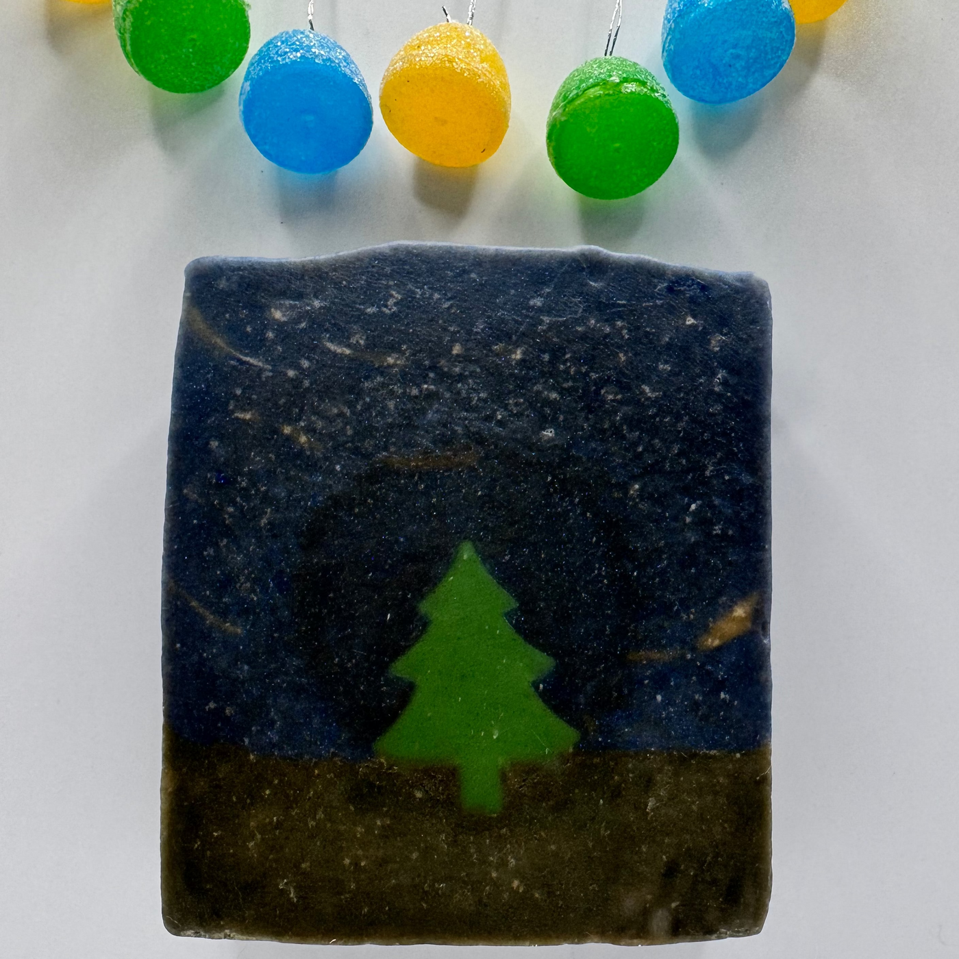 Bar of soap with a tree design on a white background