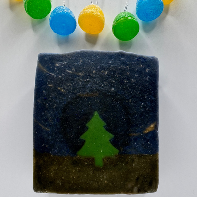 Bar of soap with a tree design on a white background