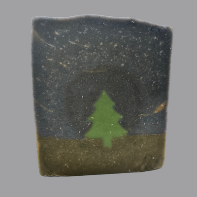 Bar of soap with a green tree design on a white background