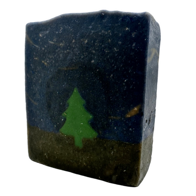 Bar of soap with a green tree design on a white background